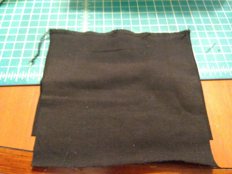 The spandex (bottom) and lining (top) fabric sewn together at the top