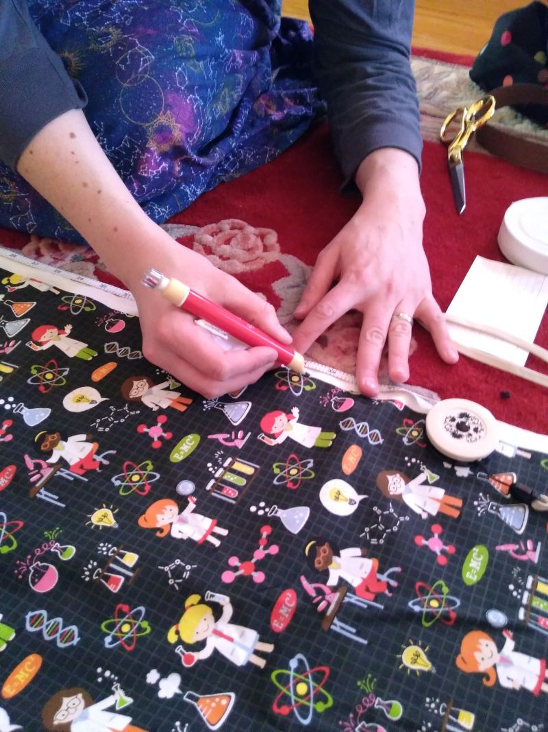 Christine measuring and marking her fabric